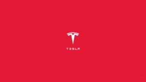 Tesla brand logo over a red background