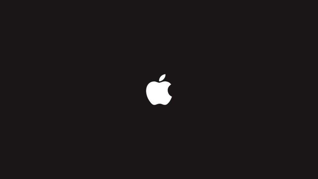 A bright Apple brand log over a dark background