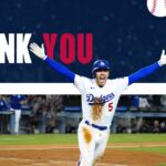 2026 World Series Thank You - Celebrating Dodgers player victory moment with arms raised in championship triumph