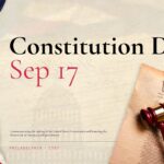 Constitution Day Template - Title cover slide with American flag, gavel, and We the People document on parchment background