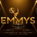 Emmy Awards 2026 Template - cinematic cover slide with gold statuette, diagonal light beams, and metallic title text
